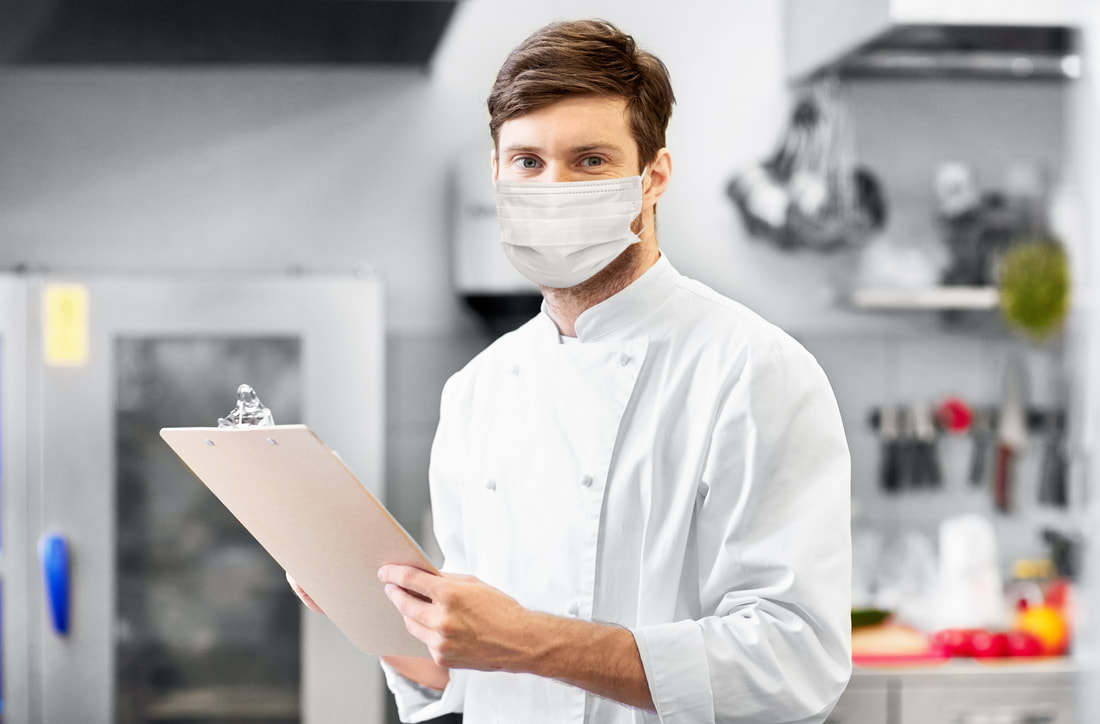 Chef with Mask and Paperwork