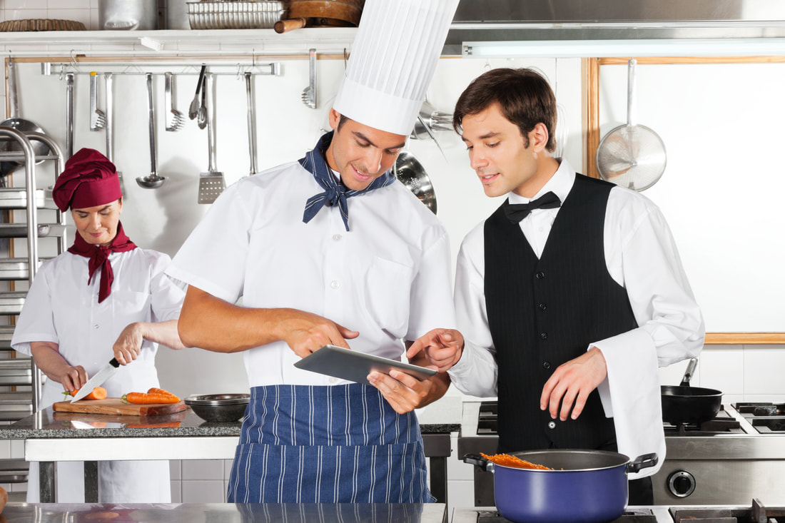 Chef & Server Looking at Tablet